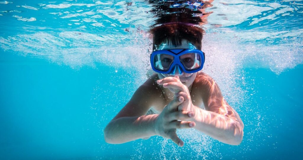 kid in swimming pool