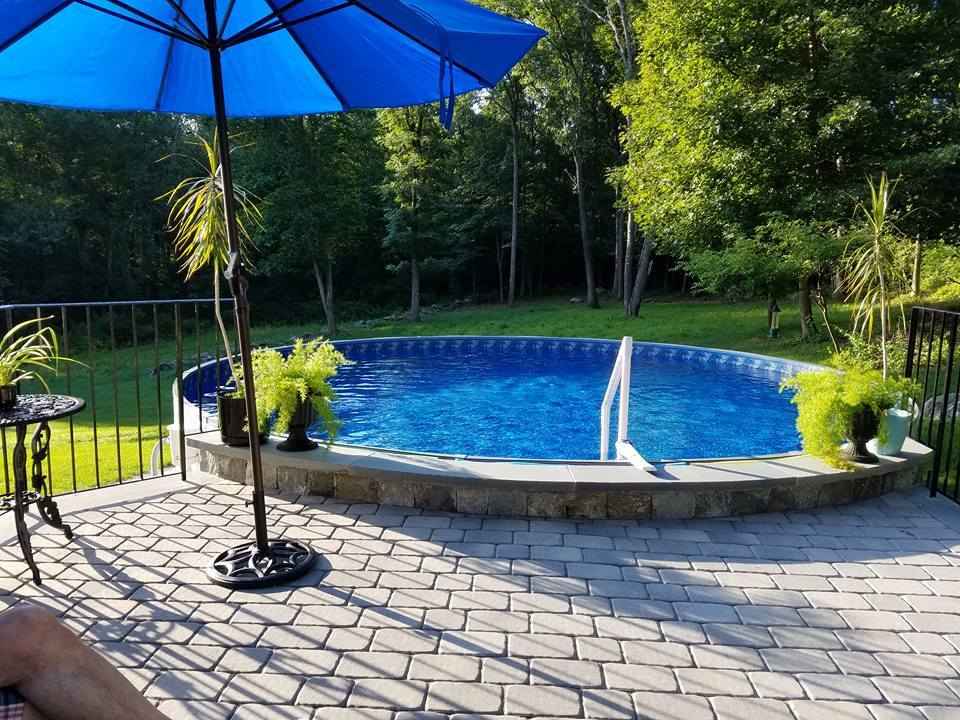 semi in-ground pool installation by Van Dorn Pools and Spas - pool supplies