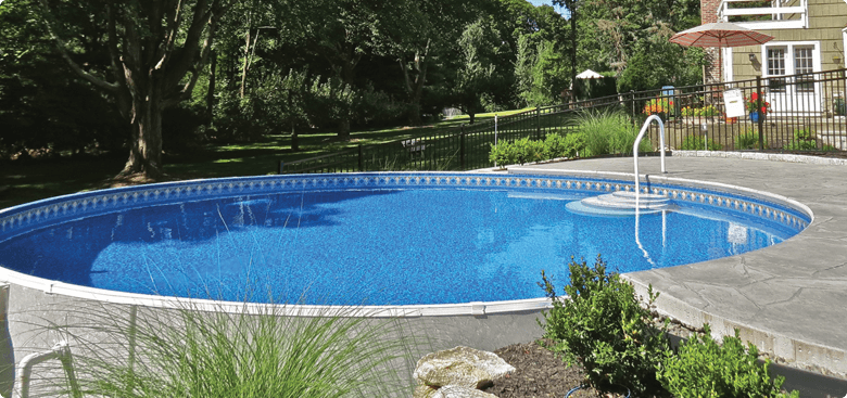 semi in-ground pool with steps surrounded by cement in Maryland