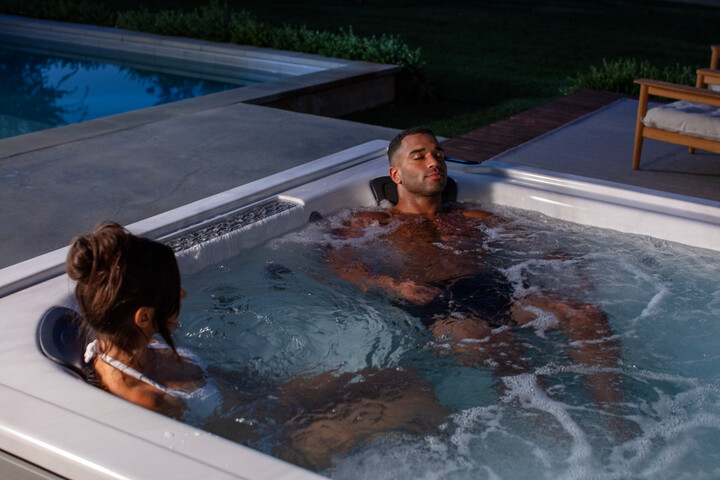 hot tub sizes - couple enjoying their hot tub